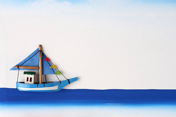istock Wooden Boat on a Picture Board 526136378