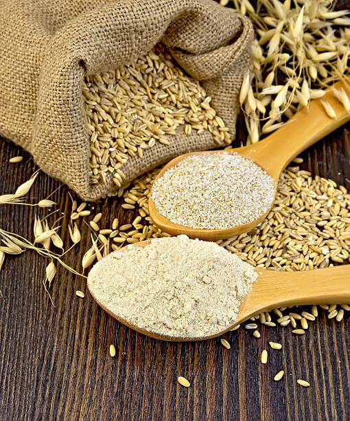 istock Flour and bran flakes oat in spoon on board 526136808