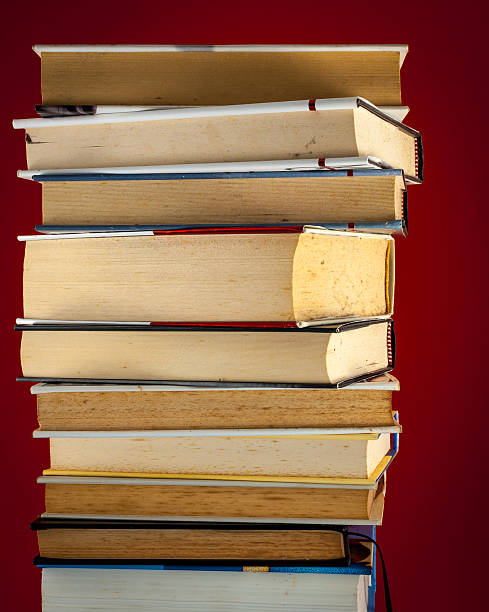 istock pile of books on colored background 526138630