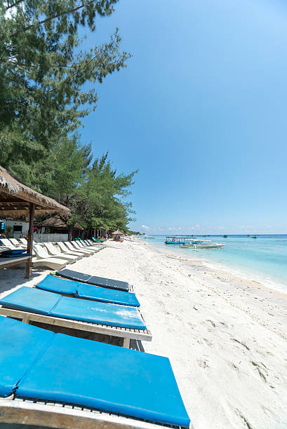 istock Tropical sandy beach with boats in a sea. 526141648