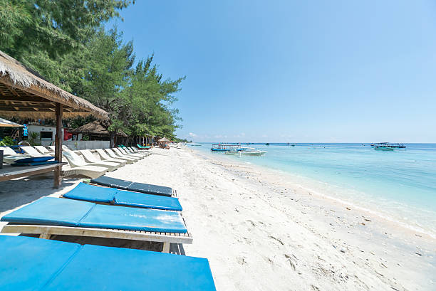 istock Tropical sandy beach with boats in a sea. 526141676