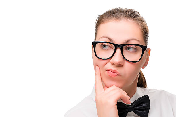 istock woman's face in close-up thinking on white background 526148208