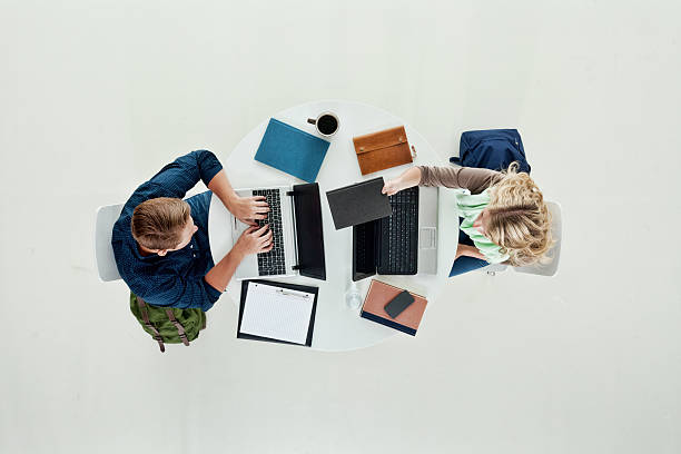 istock Above view of two students working on laptop 526149235