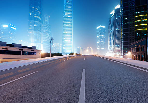 istock Asphalt road and modern city 526149273