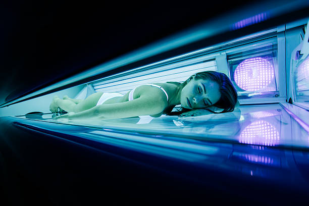 istock Beautiful woman lying in solarium 526149358