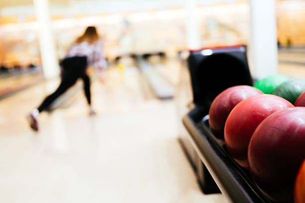 istock Woman throwing bowling ball 526149602