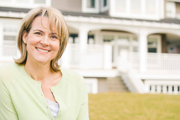 istock Wife smiling in front of her house 526149873