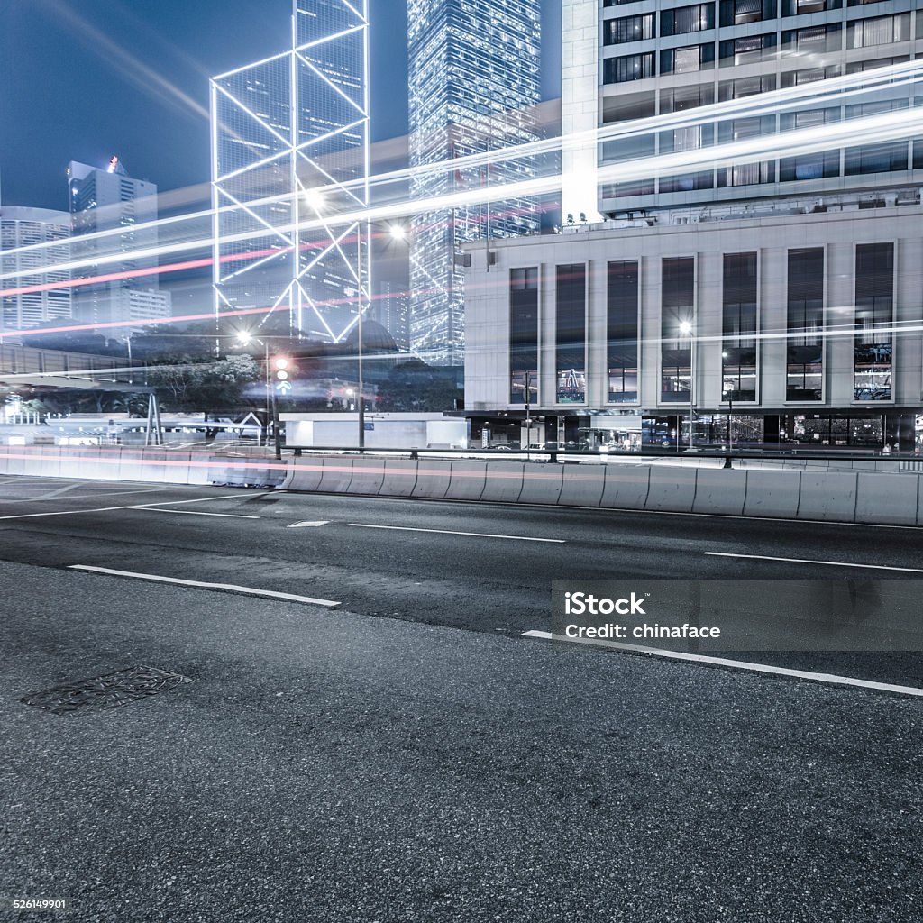 traffic through hong kong motion cars through the business district in hongkong, the lights pass in front of skyscrapers at night. Architecture Stock Photo