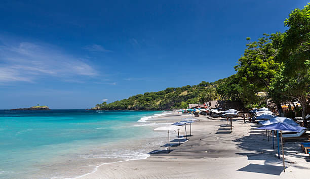 In the province of Karangasem, near Candi Dasa touristic village, a beautiful beach named Virgin Beach, attracts visitors in search of a quiet and peaceful place. Few restaurants and beach bungalows have been set up along the shore.