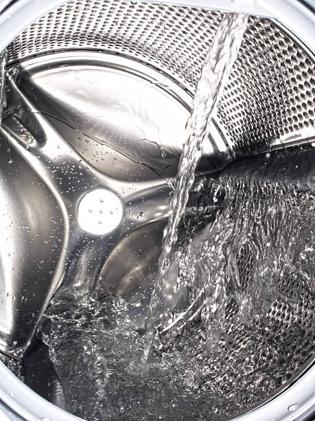 istock Washing machine drum filling with water 526152897