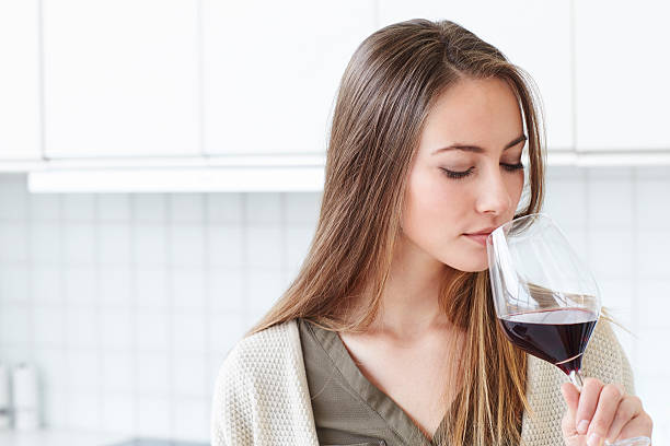 istock Beautiful woman enjoying wine 526152976