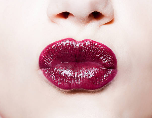 istock closeup portrait of  woman's  dark red lips 526153302