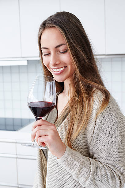 Young beautiful woman enjoying wine