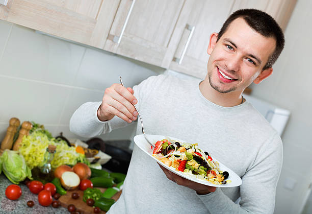 istock Cheerful handsome man holding plate 526153504