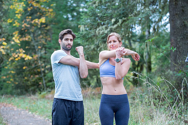 istock Couple Stretching Together After a Workout 526153642