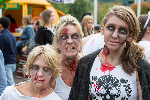 Vancouver, BC, Сanada - September 5, 2015:  A family of zombies representing mom, son and daughter participate in the Zombie Walk festival.  The September 2015 Zombie Walk in Vancouver occurred in downtown with thousands of participants and spectators.