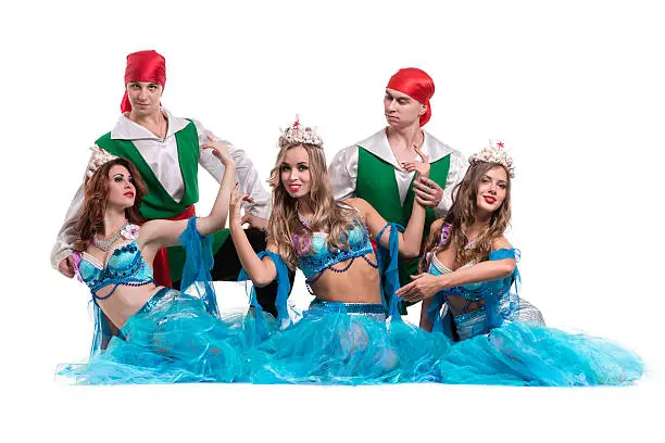 Carnival dancer team dressed as mermaids and pirates. Retro fashion style, isolated on white background in full length.
