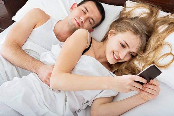 istock Beautiful Wife texting with lover on smartphone 526154932