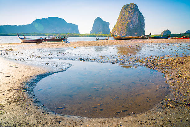 istock Beach and tropical sea with long-tail boat in thailand 526155328