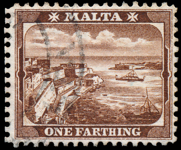 istock Stamp printed in MALTA shows One Farthing 526156045