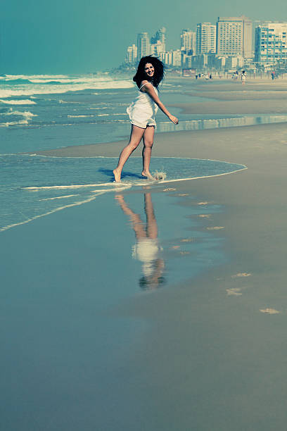 istock woman at the beach 526156519