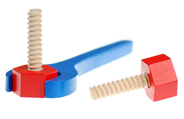 Wrench and red screws toys on white background