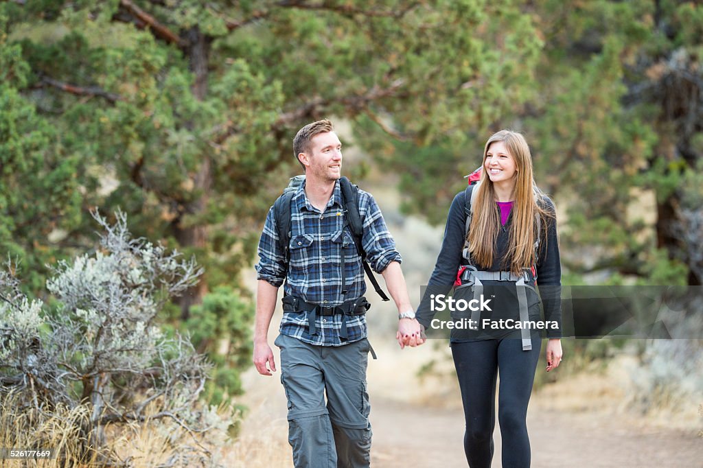 Hiking Young couple hiking together 20-29 Years Stock Photo