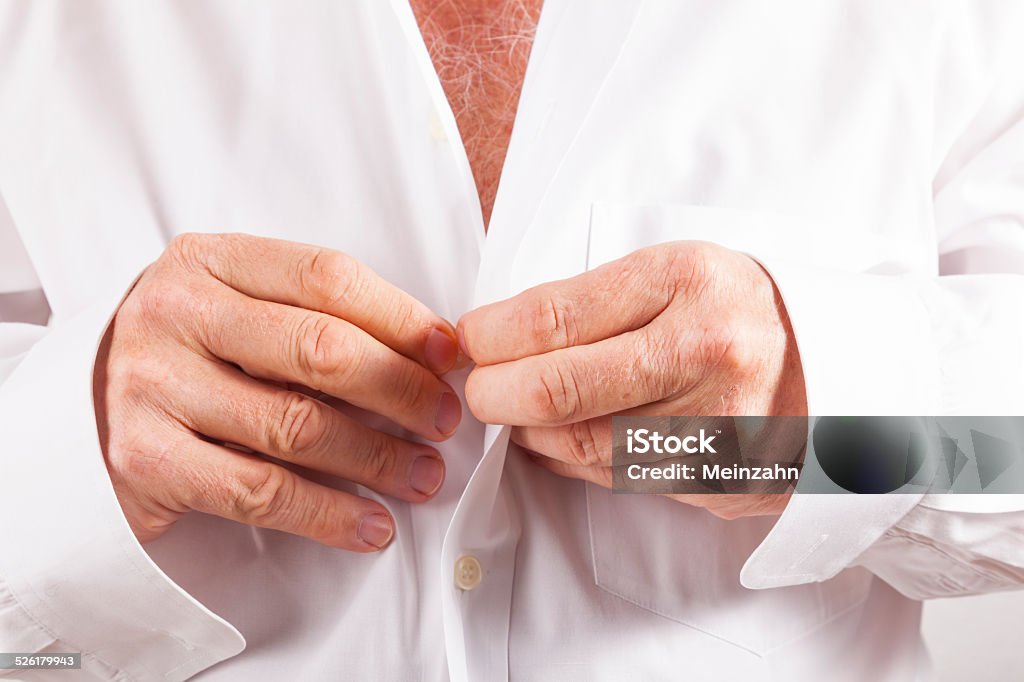 man closing his shirt Adult Stock Photo