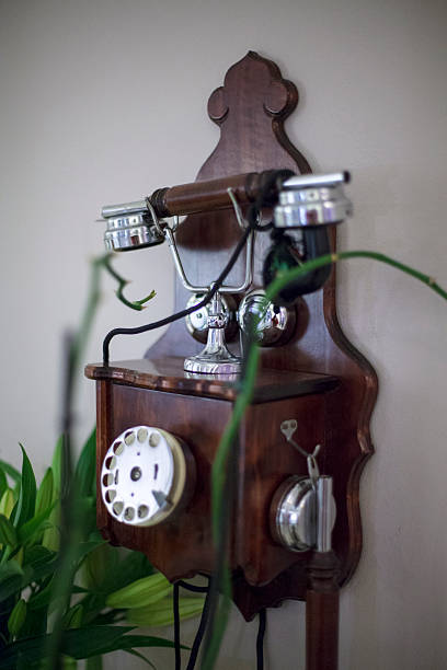 istock Old wooden wall mounted telephone 526180863