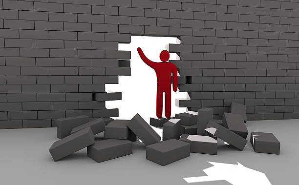 istock Abstract man breaking trough a wall. Concept of overcoming obstacles 526181247