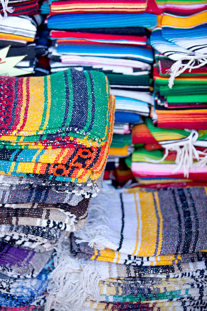 istock Stack of mexican blankets for sale 526182099