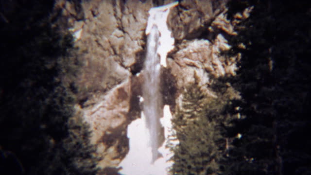 1971: Winter ice waterfall thawing showing frozen sections.