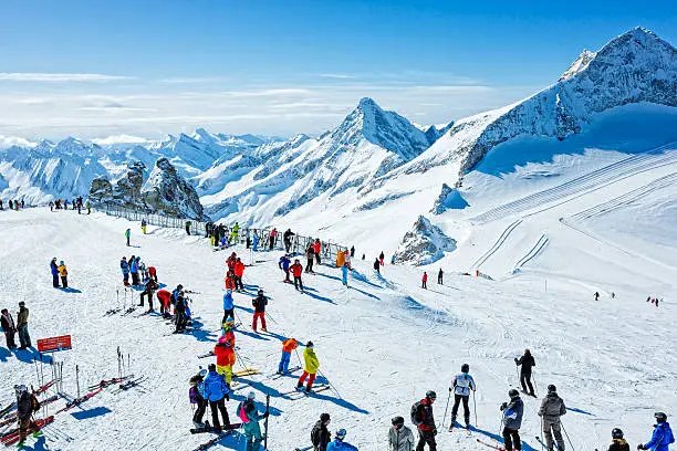Skiers on top at winter ski resort Hintertux, Tirol, Austria.