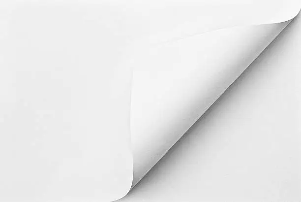 Photo of Folded sheet of paper with curled corner
