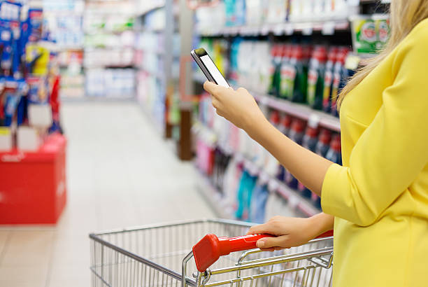 istock Woman checking shopping list on her smartphone 526199491