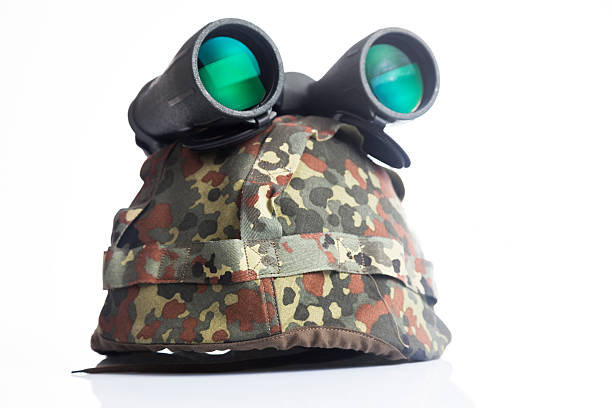 istock Military helmet and binoculars isolated on a white background 526199723