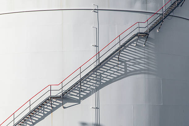 istock white tank in tank farm with blue sky 526199929