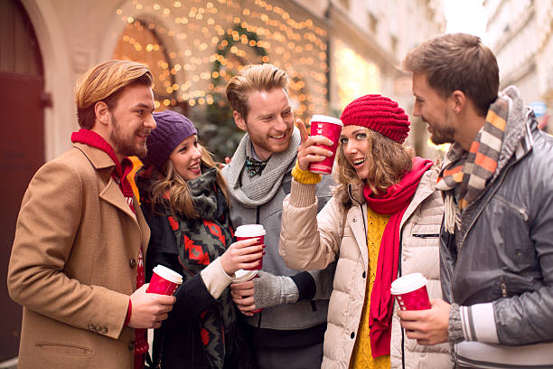 istock Friends having fun outdoors in winter city. 526209383