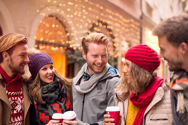 istock Friends having fun outdoors in winter city. 526209385