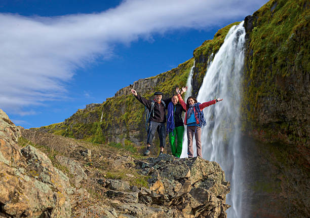 istock Group of climbers on the waterfall background, horizontal 526211567