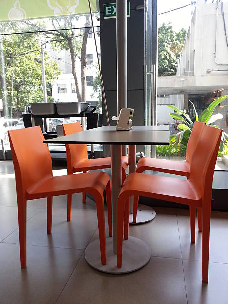 istock Four Orange Chairs in the Dinning Table 526211747