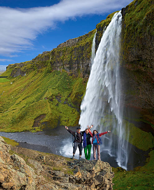 istock Group of climbers on the waterfall background, vertical 526212077
