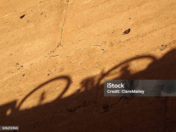 Bicycle Shadow On A Wall Of The El Badi Palace Stock Photo - Download Image Now - Ancient, Antiquities, Arid Climate