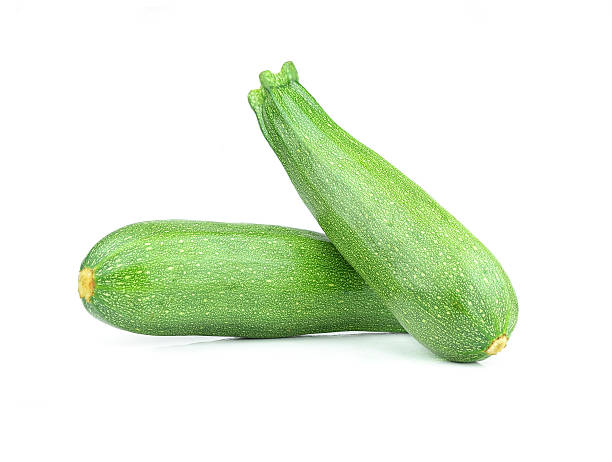 istock Pair of fresh green zucchini isolated on white background 526212561