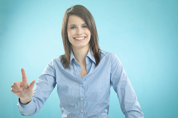 Businesswoman gesturing, smiling