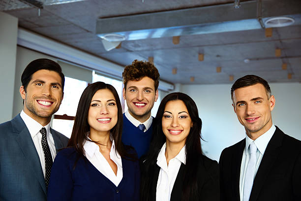 istock business people standing together in office 526215543