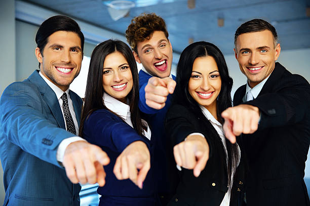 istock business group poiting at the camera 526215691