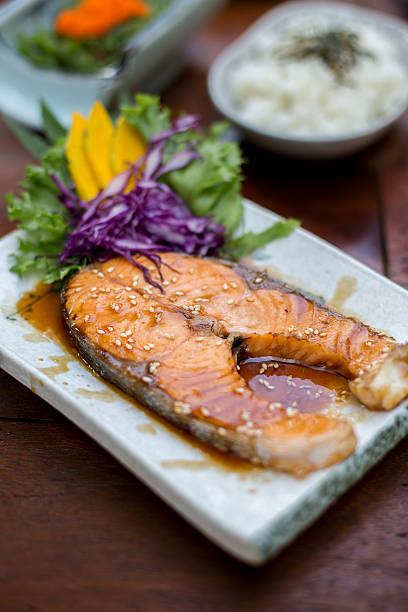 istock Grilled salmon  on wooden background - Selective focus poin 526216317