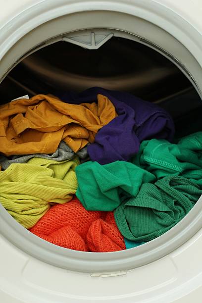 istock Washing machine full of dirty clothes 526216627