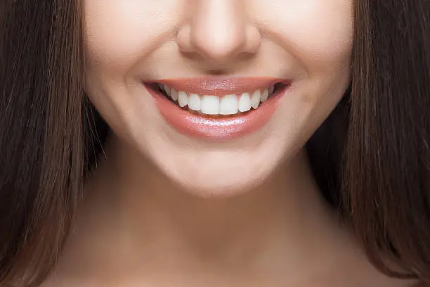 Photo of Woman smile. Teeth whitening. Dental care.